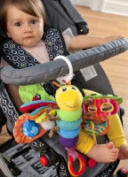 baby in buggy with LAMAZE FREDDIE THE FIREFLY