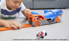 CHILD PLAYING WITH HOT WHEELS CITY SHARK CHOMP TRANSPORTER